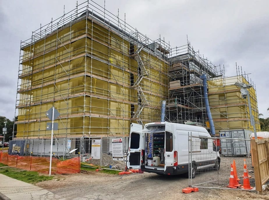 5.-Van-infront-of-building Home